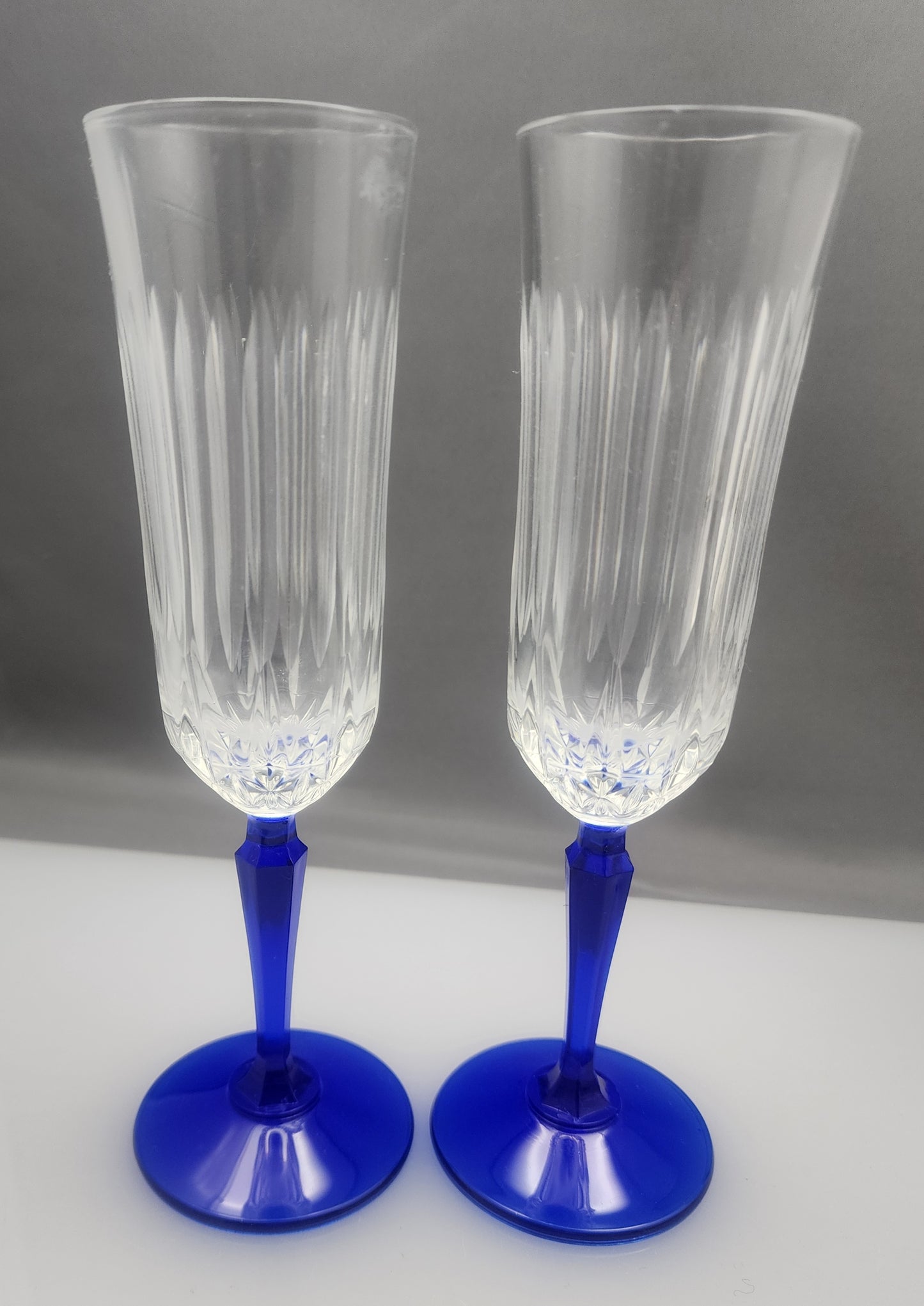 Pair Cut glass flutes blue stem Hand cut