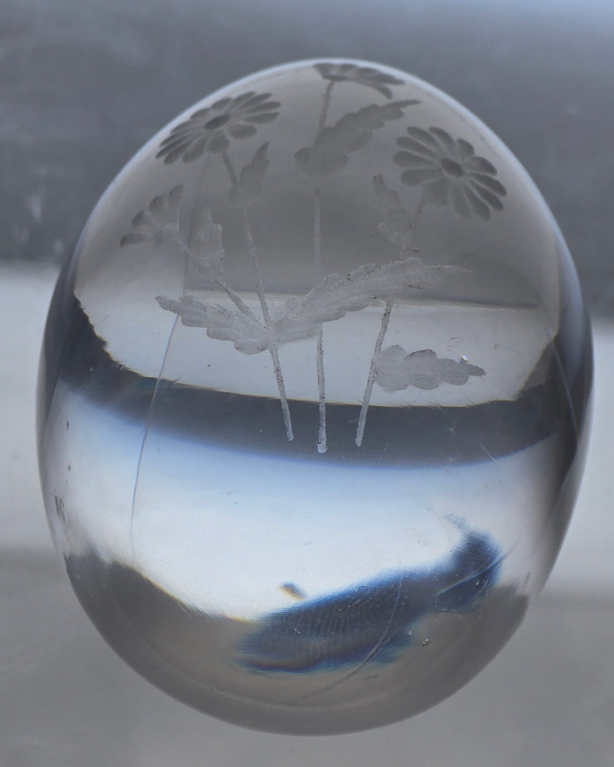 Glass egg paperweight with copper wheel engraved flowers
